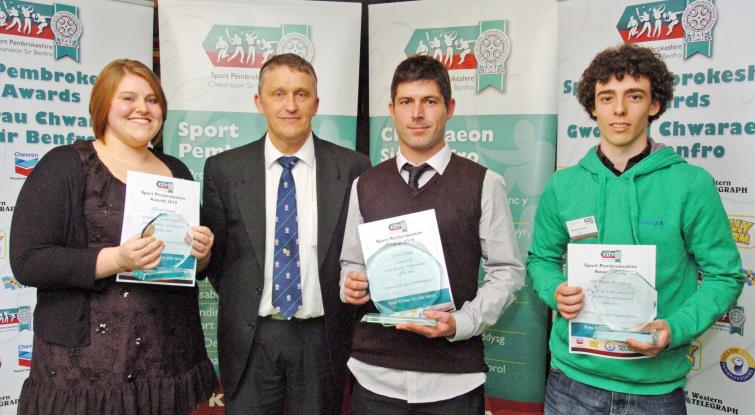 Paul Jones (3rd left) receives his Sport Pembrokeshire award from Cllr Rob Lewis